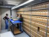 Sfeerimpressie archiefruimte met medewerkers